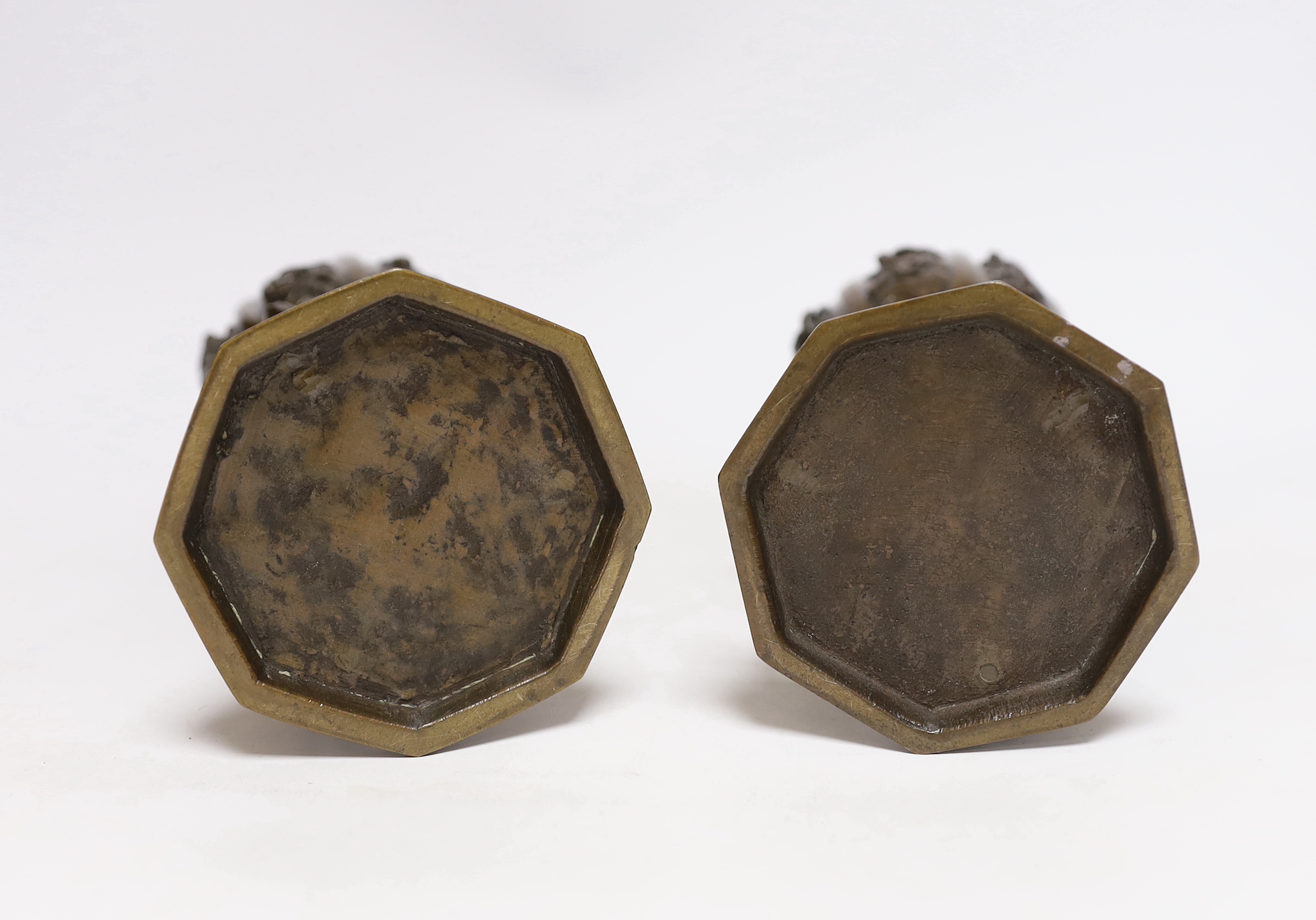A pair of Japanese bronze vases on tripod legs, 24.5cm
